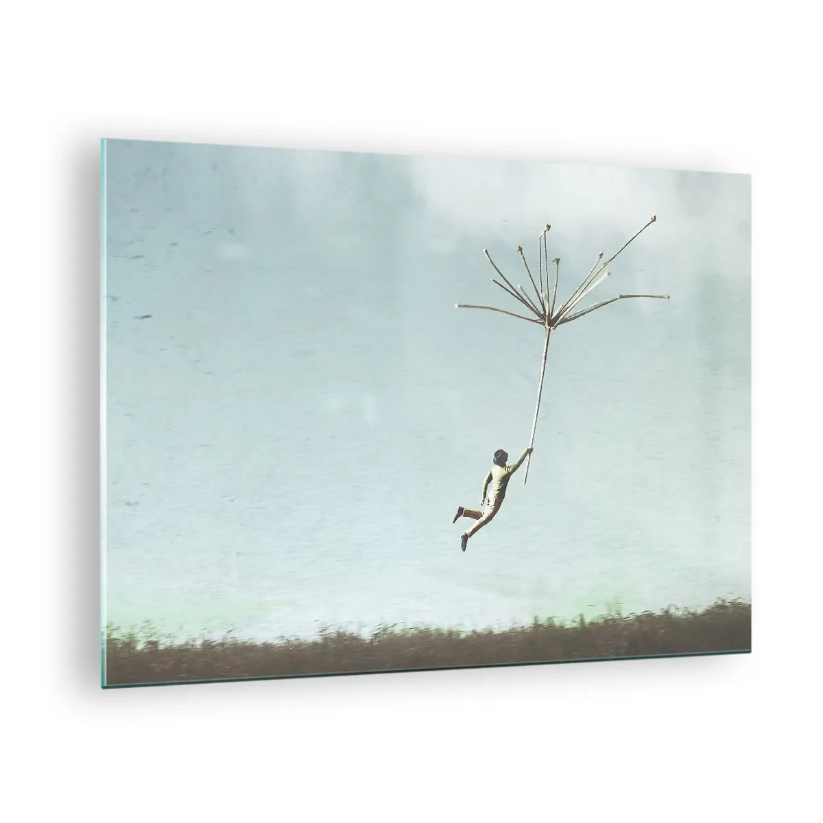 Impression sur verre - Image sur verre - Un garçon volant avec une graine de pissenlit au-dessus d'une prairie - 70x50cm - Cerfs-volants, pissenlits, vent - Décoration murale moderne pour le salon et la chambre ARTTOR